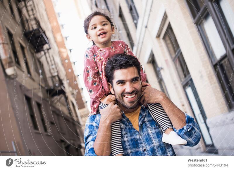 Father carrying daughter on his shoulders father pa fathers daddy dads papa Stroll walk Fun having fun funny daughters people persons human being humans