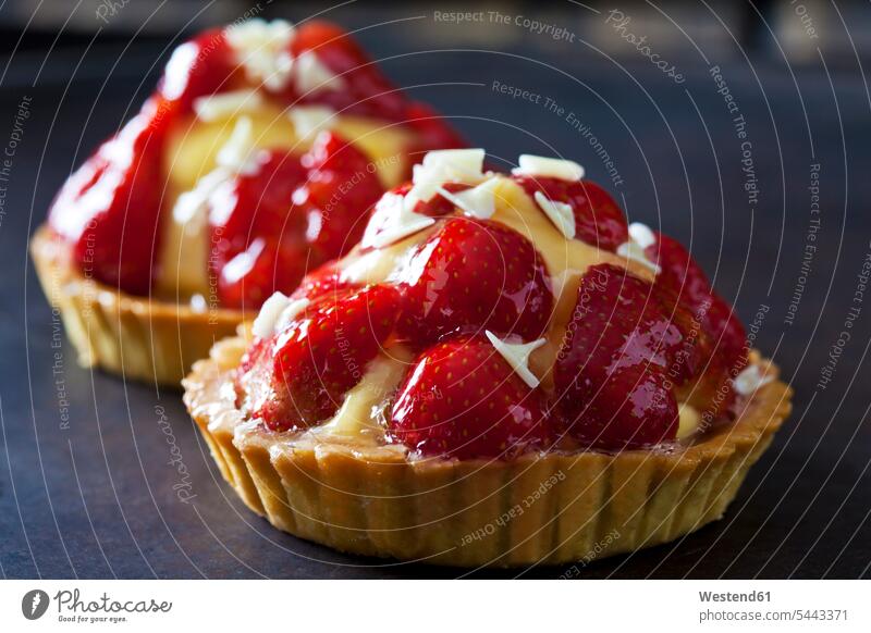 Strawberry tartlets with custard and white chocolate shaving Seduction Seductive seducing Seducement Shortcrust Pastry homemade home made home-made gleaming
