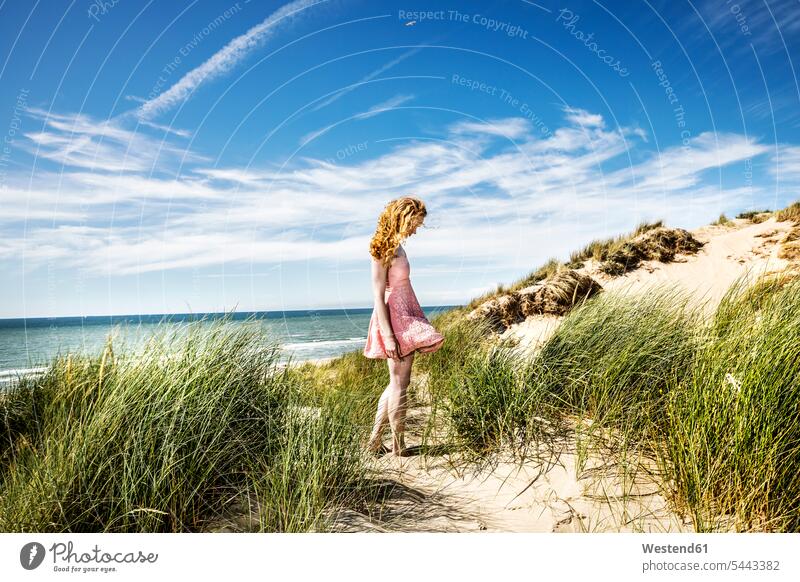 Netherlands, Zandvoort, woman standing in dunes sand dune sand dunes beach beaches females women Adults grown-ups grownups adult people persons human being