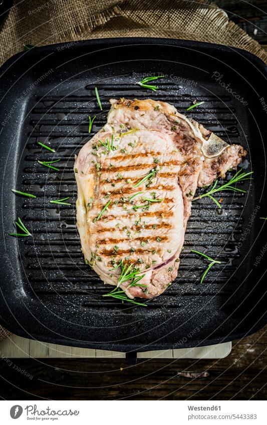 Roasted beefsteak with rosemary in pan copy space healthy eating nutrition Steak Steaks nobody overhead view from above top view Overhead Overhead Shot