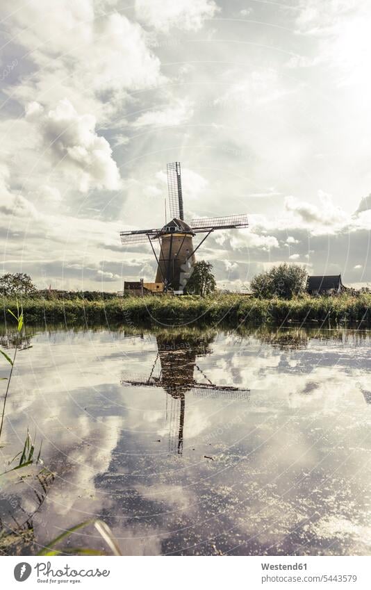 Netherlands, Kinderdijk, Kinderdijk wind mill cloud clouds water reflection water reflections nature natural world outdoors outdoor shots location shot