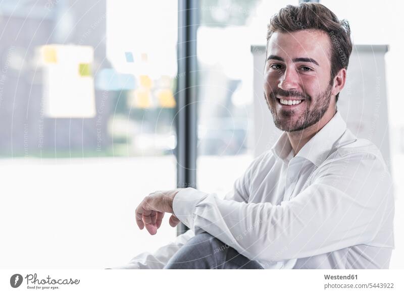 Portrait of smiling businessman in office smile Businessman Business man Businessmen Business men portrait portraits business people businesspeople