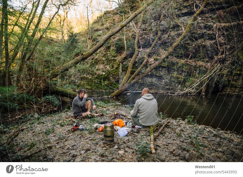 Young men grilling Experience Experiences barbecueing Barbecuing getting away from it all Getting Away From All unwinding relaxing Picnic picnicking Fire