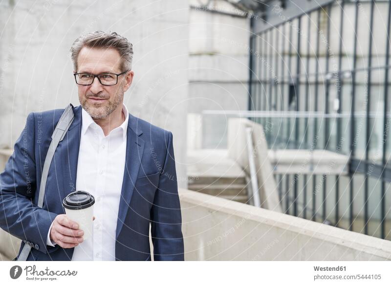 Portrait of businessman with coffee to go Businessman Business man Businessmen Business men portrait portraits business people businesspeople business world