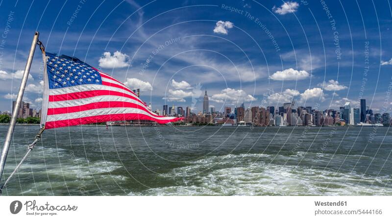 USA, New York, East River, American Flag, View to Midtown Manhattan Panorama cloud clouds metropolis New York City flag flags water patriotism patriotic