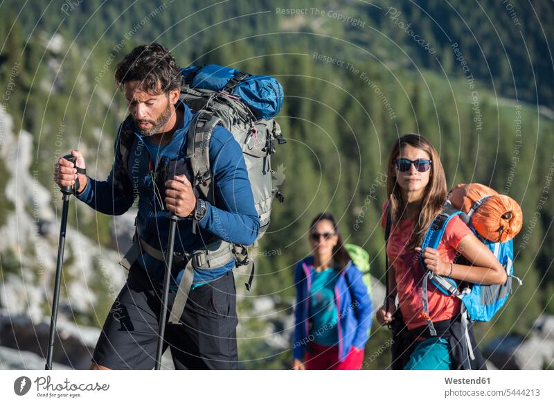 Italy, Friends trekking in the Dolomtes friends ascent active Dolomites Dolomite Alps hiking climber alpinists climbers mountaineer Mountain Climber