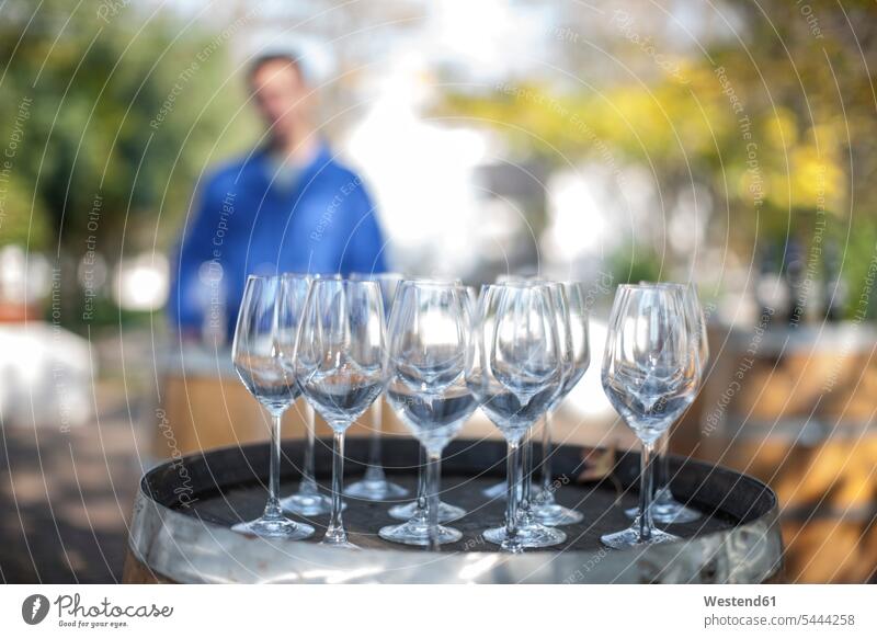 https://www.photocase.com/photos/5444258-empty-wine-glasses-on-barrel-with-estate-wotker-in-background-photocase-stock-photo-large.jpeg