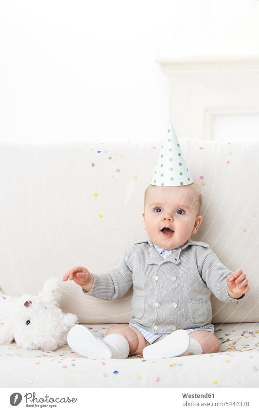 Portrait of amazed baby boy wearing paper hat portrait portraits baby boys male infants nurselings babies people persons human being humans human beings Cap