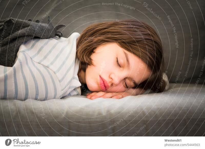 Portrait of girl sleeping on couch portrait portraits females girls lying laying down lie lying down asleep settee sofa sofas couches settees child children kid