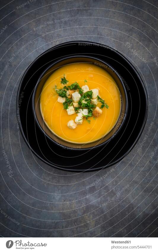 Soup dish of creamed pumpkin soup with croutons and parsley Soup Bowl nobody overhead view from above top view Overhead Overhead Shot View From Above