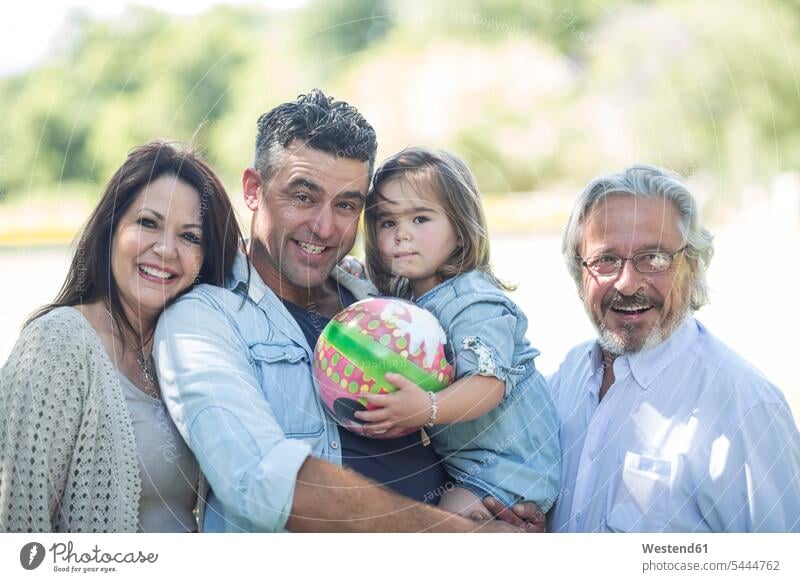 Portrait of smiling extended family outdoors smile families generations portrait portraits people persons human being humans human beings father pa fathers