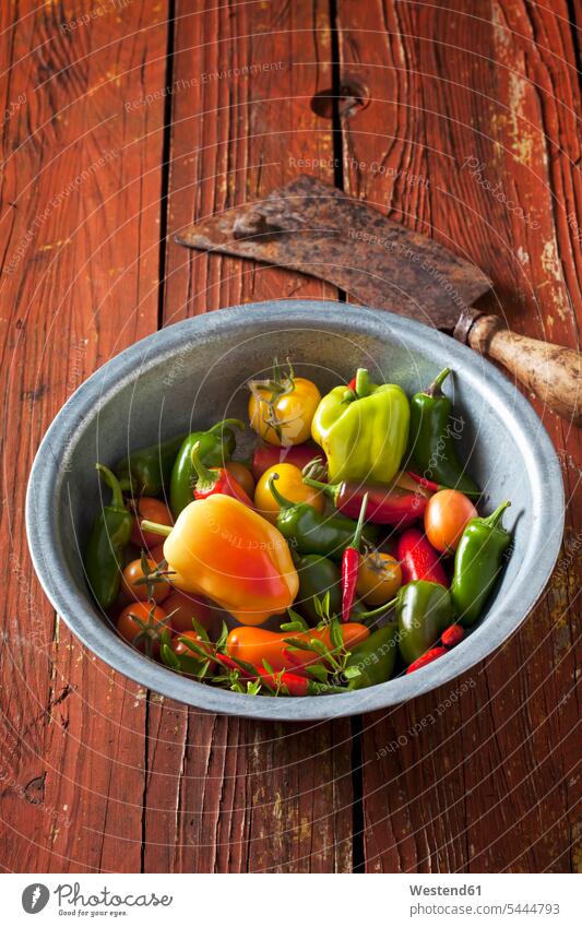 Bowl of organic vegetables on wood Bowls elevated view High Angle View High Angle Shot healthy eating nutrition wooden gleaming organic edibles firm sort sorts