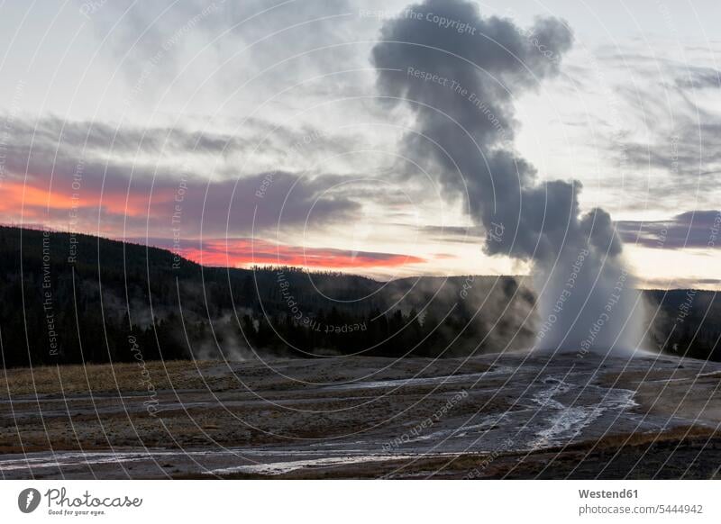 USA, Yellowstone Park, Wyoming, Old Faithful Geyser erupting motion Movement moving cloudy cloudiness clouds dawn atmosphere atmospheric morning twilight aurora