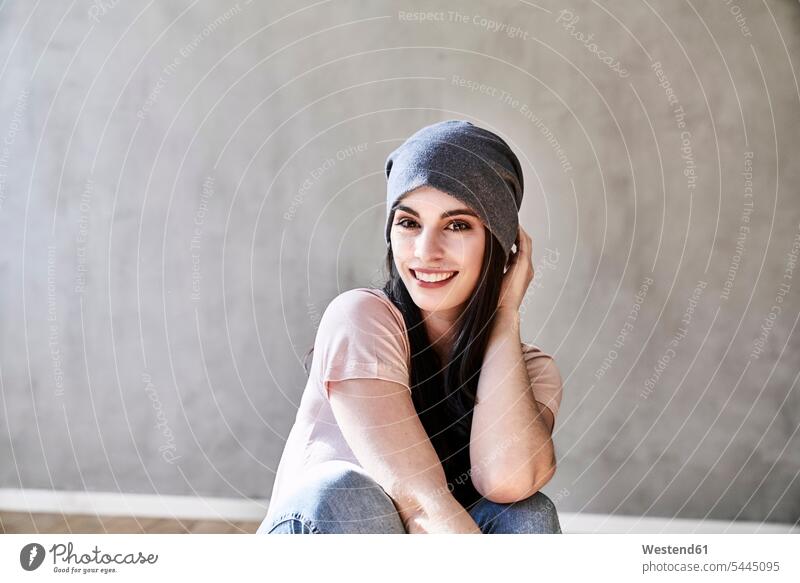 Portrait of smiling young woman wearing beanie smile females women portrait portraits Adults grown-ups grownups adult people persons human being humans