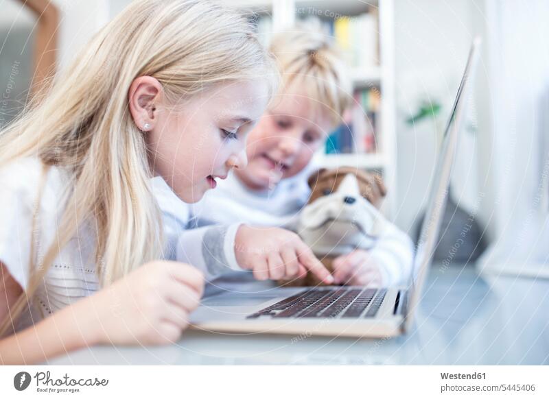 Brother and sister using laptop together sisters brother brothers Laptop Computers laptops notebook siblings brother and sister brothers and sisters family