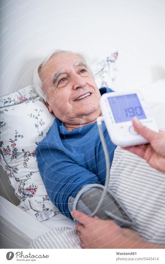 Patient gets blood pressure measured caucasian caucasian ethnicity caucasian appearance european assistance Looking After support care sheltered housing