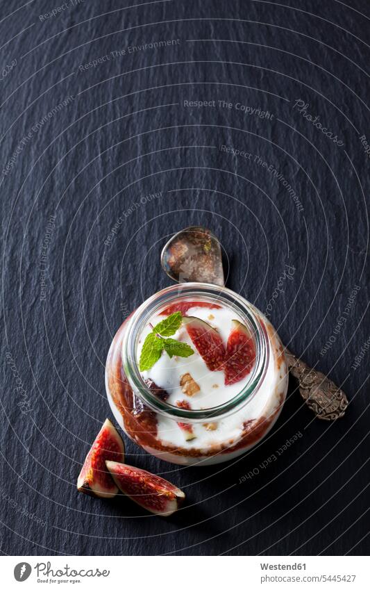 Glass of Mascarpone cream with fig compote and walnuts on slate food and drink Nutrition Alimentation Food and Drinks cinnamon stick cinnamon sticks Glasses