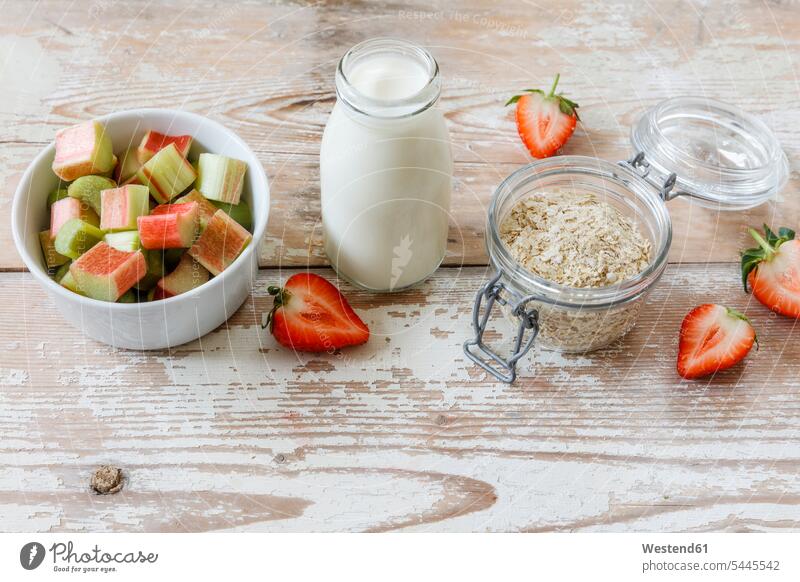 Milk, strawberry, rhubarb and oat flakes Bottle Bottles studio shot studio shots studio photograph studio photographs wood wooden Oat Oats healthy eating