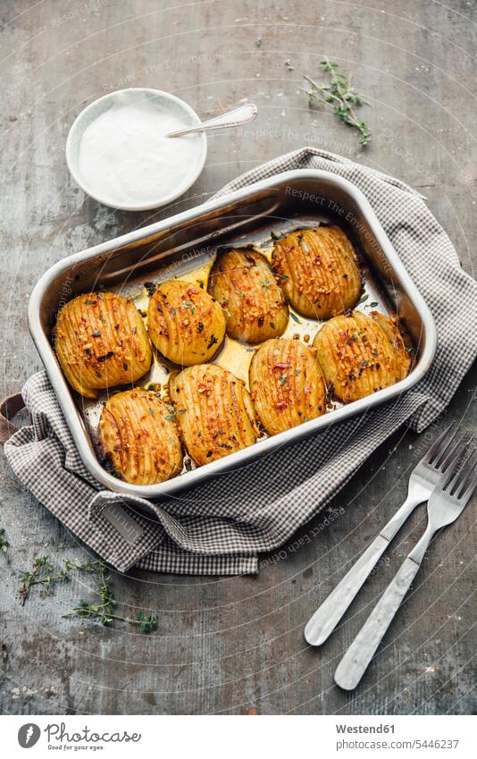 Baked Hasselback poataoes in baking tray olive oil potato potatoes Hasselback poatoes Hasselback poatato baked Baked Food wood wooden roasting pan preparation