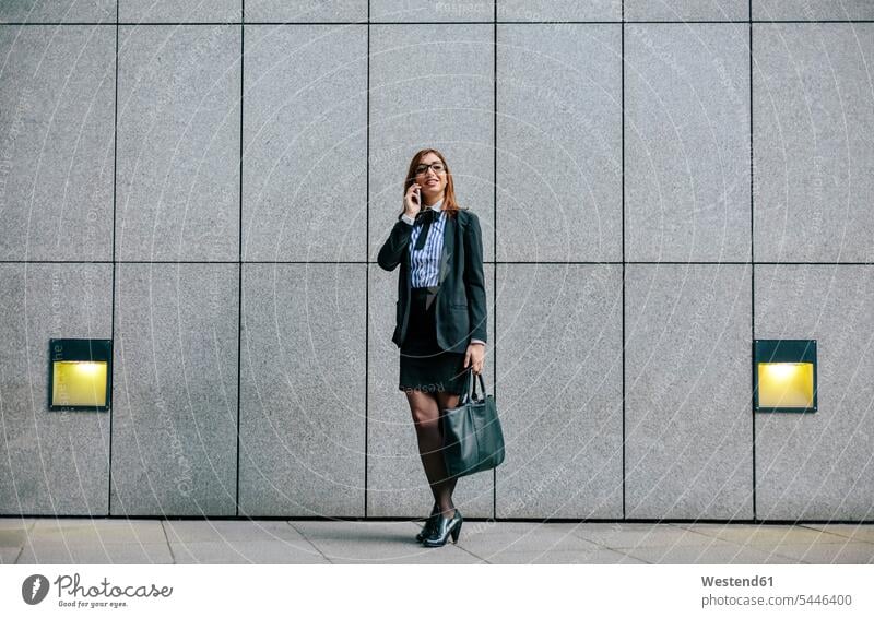 Businesswoman talking on the phone speaking mobile phone mobiles mobile phones Cellphone cell phone cell phones businesswoman businesswomen business woman