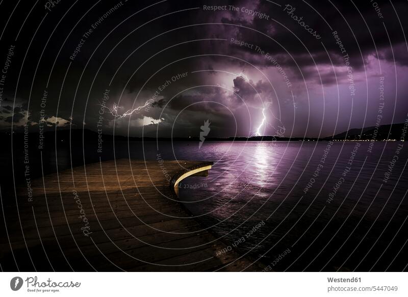 Italy, thunderstorm at a lake at night horizon copy space horizons View Vista Look-Out outlook jetty jetties nature natural world outdoors outdoor shots