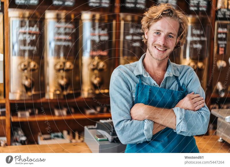 Portrait of smiling coffee roaster in his shop smile man men males portrait portraits Adults grown-ups grownups adult people persons human being humans