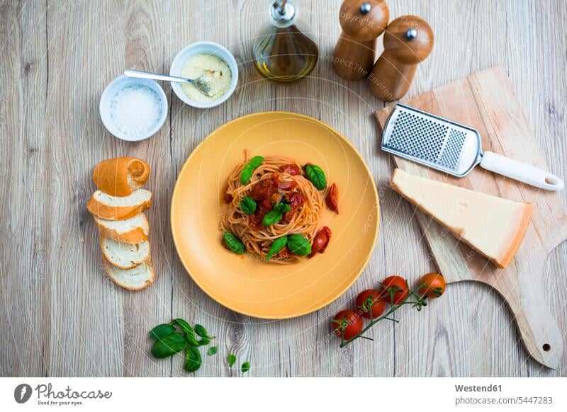 Spaghetti with cherry tomatoes and basil on a plate Plate dish dishes Plates prepared parmesan Parmesan Cheese garnished Italian Food Italian cuisine