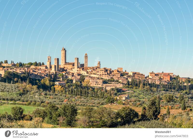 Italy, Tuscany, San Gimignano, townscape with gender towers outdoors outdoor shots location shot location shots Architecture looking looks autumn fall landmark