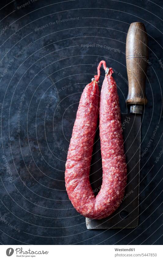 Minced pork sausage ring copy space minced pork sausage Mettwurst Sausage Ring cleaver chopping knife chopper cleavers choppers chopping knives studio shot