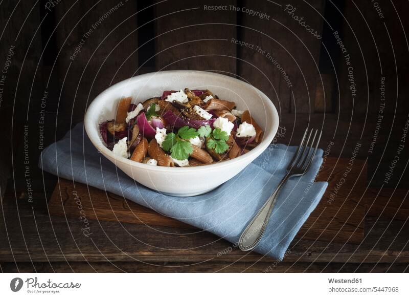 Spelt rigatoni with aubergines, feta and raisins Bowl Bowls napkin napkins cloth napkin cloth napkins prepared hearty savoury food lusty dish dishes