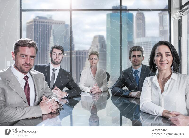 Portrait of confident businessmen and businesswomen sitting in conference room colleagues office offices office room office rooms Businessman Business man