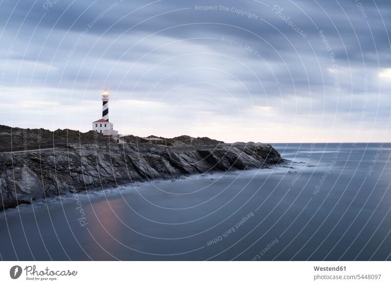 Spain, Balearic Islands, Menorca, Favaritx lighthouse surrounded by clouds in the morning coast coastline coast area Seacoast seaside Travel destination