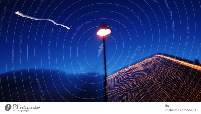 zoom Lamp Lantern Light Night Domestic lighting Fairy lights Stripe Strip of light White Zoom effect Long exposure Evening Moon Sky Blue Orange Mountain Blur