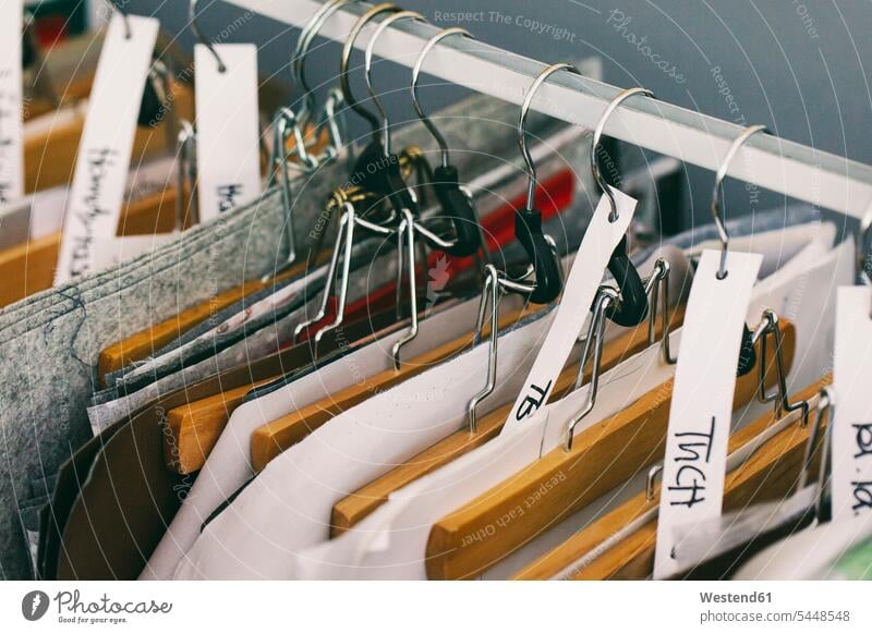 Clothes rail in tailor shop hanger clothes hangers coat-hangers selection Assortment tailoring clothes rail clothes rails crafts enterprise