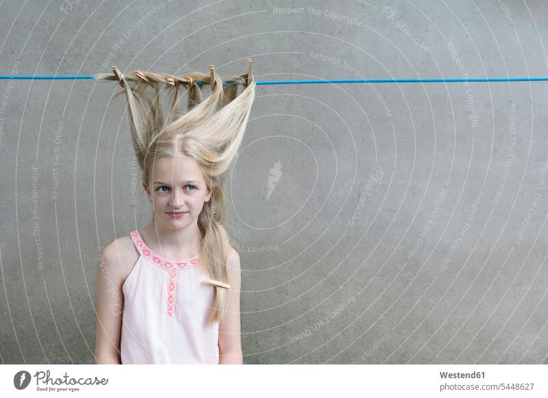 Blond girl's hair drying on clothesline females girls portrait portraits people persons human being humans human beings child children kid kids Clothesline