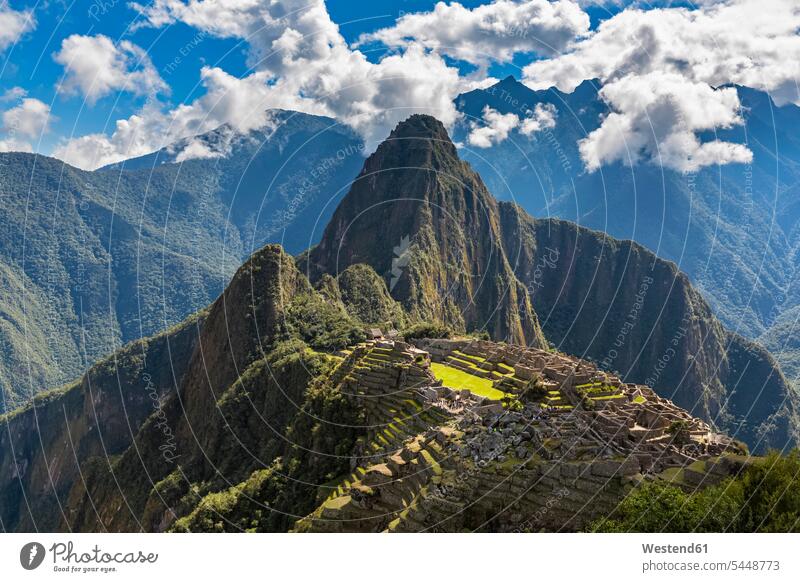 Peru, Andes, Urubamba Valley, Machu Picchu with mountain Huayna Picchu cloud clouds sunlight Sunlit Old Ruin Ruins Old Ruins mountains Architecture outdoors