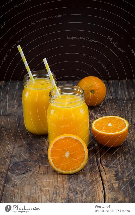 Freshly squeezed orange juice in jars with straws food and drink Nutrition Alimentation Food and Drinks freshly squeezed sliced drinking straw drinking straws
