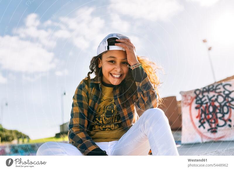 Portrait of smiling girl wearing baseball cap females girls portrait portraits child children kid kids people persons human being humans human beings smile