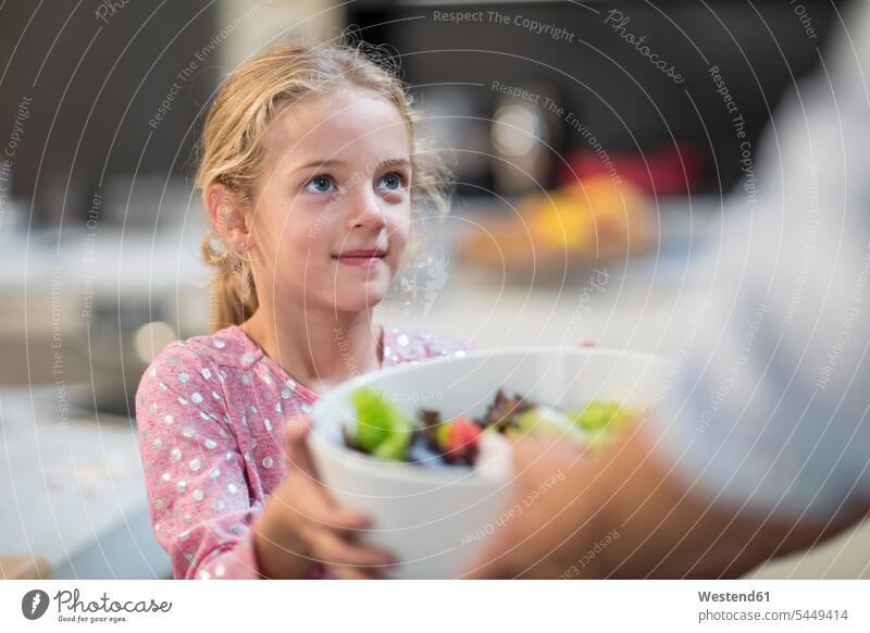 Girl receiving bowl of salad Bowl Bowls smiling smile Salad Salads portrait portraits Food foods food and drink Nutrition Alimentation Food and Drinks