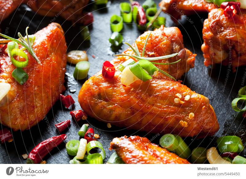 Marinated and grilled chicken wings, close-up overhead view from above top view Overhead Overhead Shot View From Above culinary herb culinary herbs kitchen herb