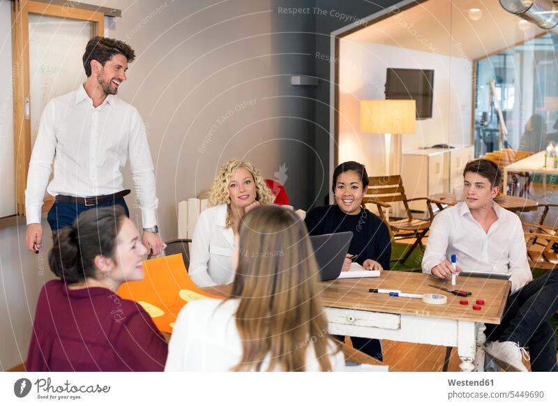 Business people attending a workshop in the office Leadership project projects learning board boards explaining Planning planning planned strategy strategic