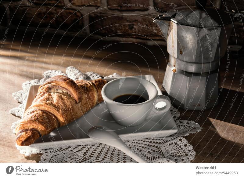 Cup of espresso and a Croissant Espresso food and drink Nutrition Alimentation Food and Drinks copy space porcellain spoon spoons Porcelain hot beverage
