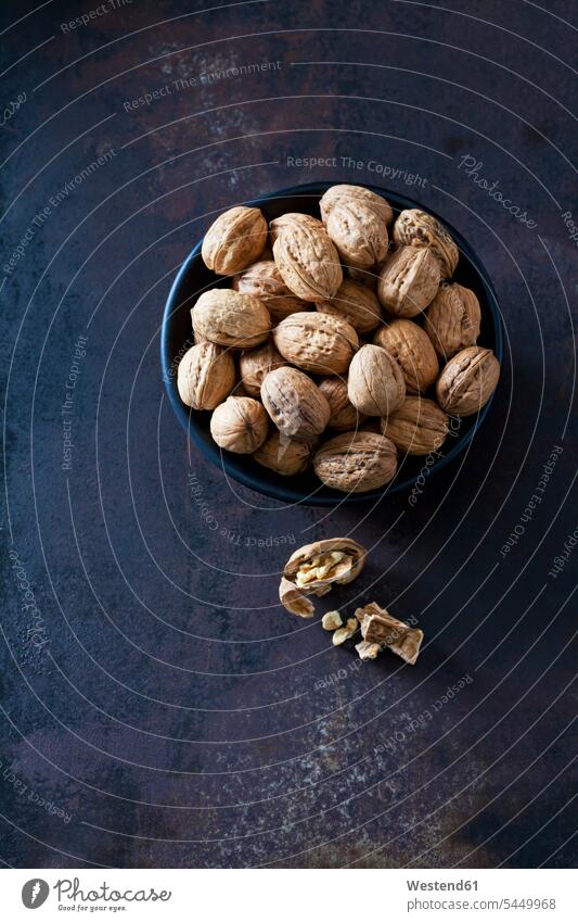 Bowl of walnuts on dark metal overhead view from above top view Overhead Overhead Shot View From Above still life still-lifes still lifes whole Walnut Walnuts