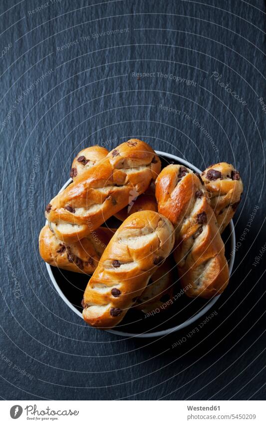 Plate of chocolate buns on slate food and drink Nutrition Alimentation Food and Drinks bittersweet chocolate semisweet chocolate dark chocolate yeast dough