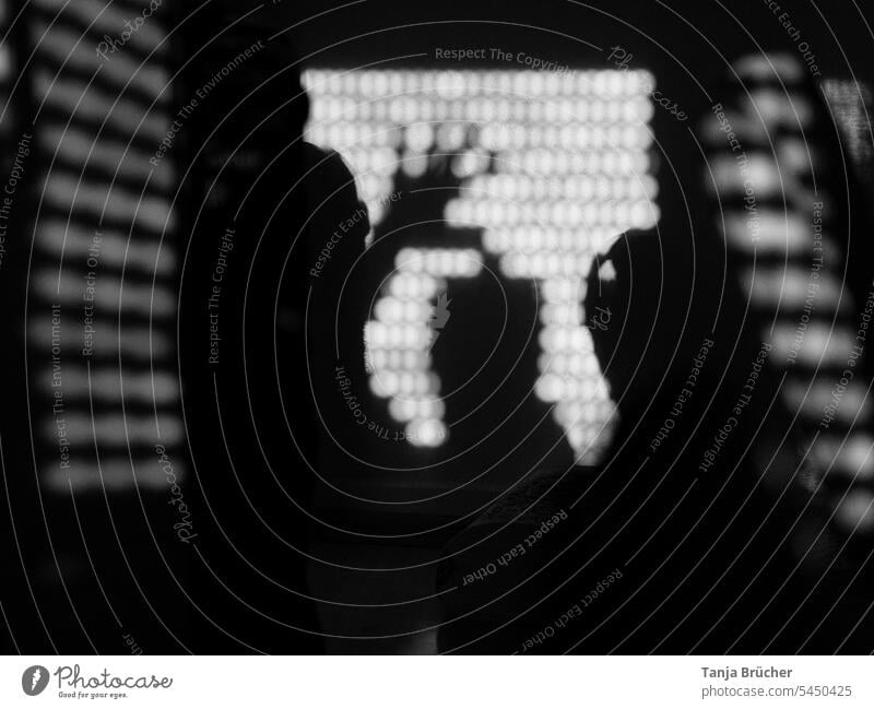 Shadow play of human silhouette with hand and many patterns in black and white Silhouette shadow theatre Head and hand black-and-white Black & white photo