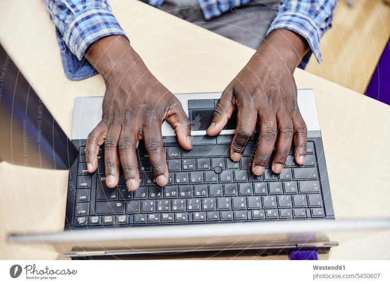 Close-up of man using laptop office offices office room office rooms Laptop Computers laptops notebook men males workplace work place place of work computer