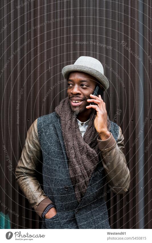 Portrait of stylish man on the phone call telephoning On The Telephone calling Smartphone iPhone Smartphones men males telephone call Phone Call using phone