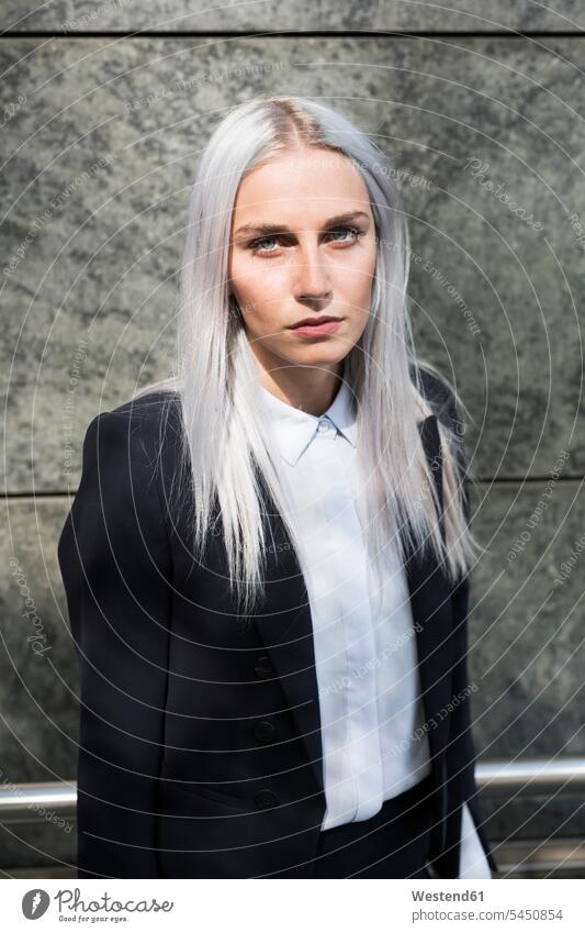 Portrait of serious young businesswoman outdoors portrait portraits businesswomen business woman business women females earnest Seriousness austere