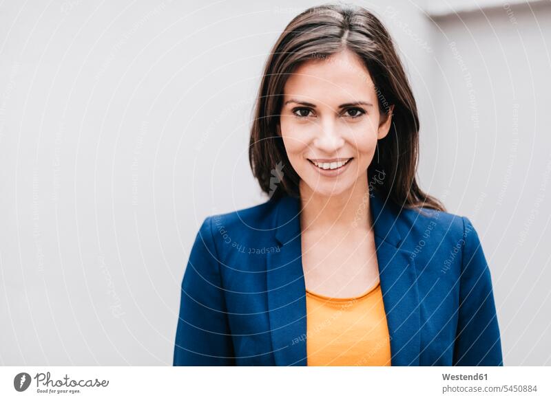 Portrait of smiling businesswoman smile businesswomen business woman business women portrait portraits attractive beautiful pretty good-looking Attractiveness