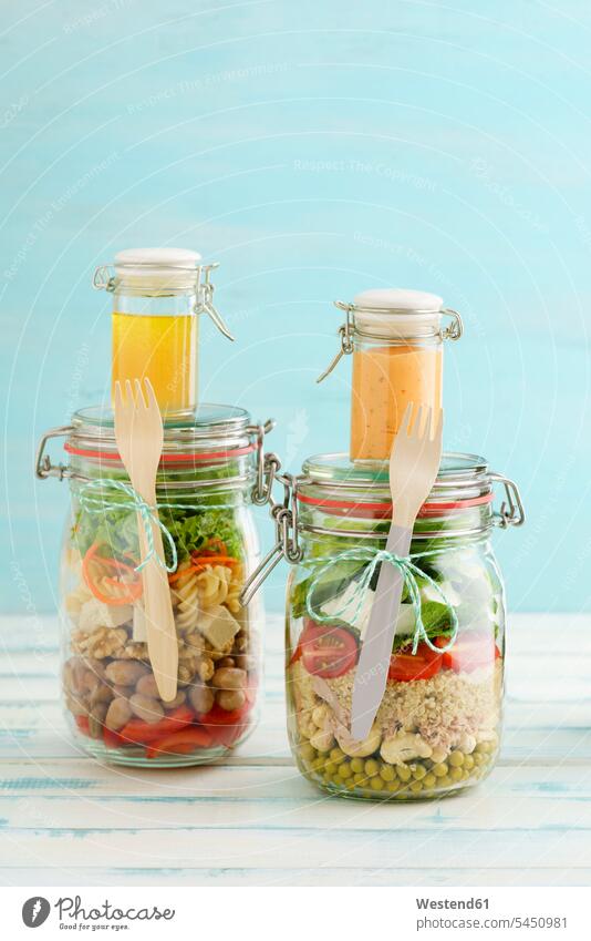 Preserving jars of mixed salads and jars of dressings various different Tomato Tomatoes ready to eat ready-to-eat prepared rich in vitamines preserving jar